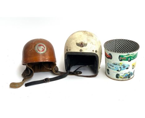 A vintage motorcycle helmet with pegasus logo, together with an Owen's 'Mastergarde' 7 1/8 white crash helmet and a vintage m