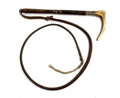 A Swain Adeney ladies hunting whip, with two silver collars, the first marked with an armorial crest of a boar's head, the se