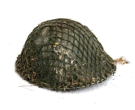 A WWII helmet with webbing 