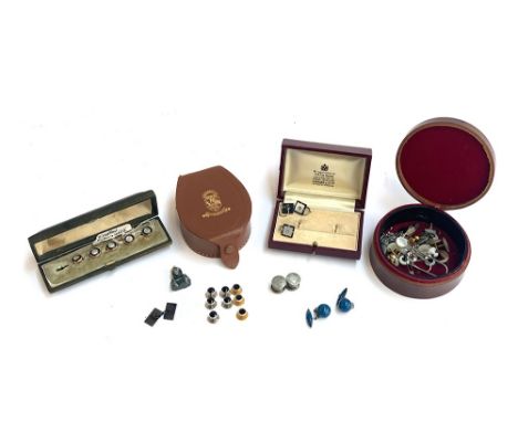 Several leather and other stud boxes containing a quantity of gents studs and cufflinks, to include Garrard &amp; Co. box; a 