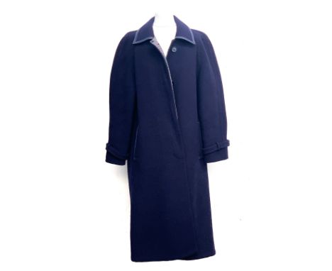 An Aquascutum ladies navy blue overcoat, with light tweed lining 