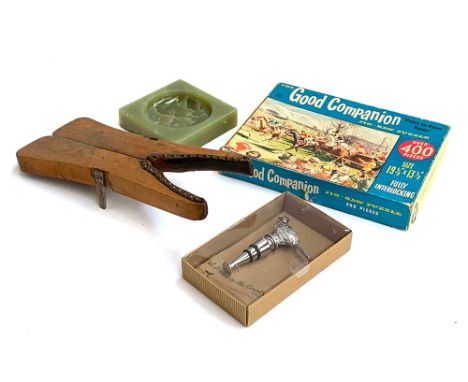 A folding boot jack; together with a vintage point to point jigsaw, an onyx ashtray, and a pheasant stopper 