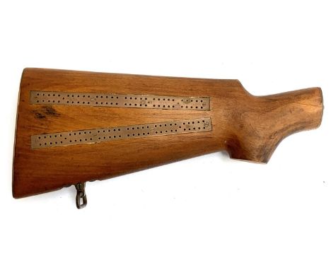 A cribbage board made from the stock of an Enfield gun, approx. 30.5cmL