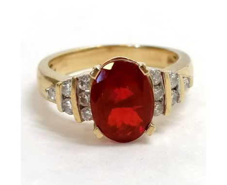 18ct marked gold, fire opal &amp; diamond shouldered stone set ring - size Q &amp; 6.9g total weight - fire opal has some sli