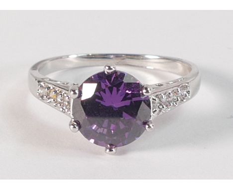 10k white gold dress ring set with round purple stone, size R,3.1g. 