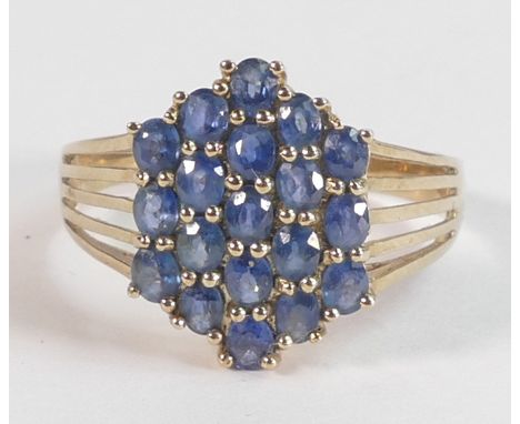 Ladies 9ct gold ring set with blue stones, size X,3.8g. 