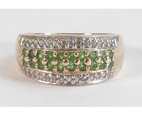Ladies 9ct gold ring set with green stones, size N,5.1g. 