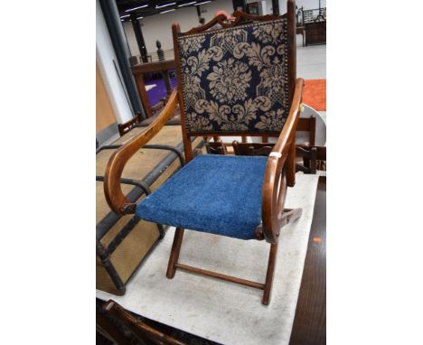 A 19th Century mahogany frame folding chair having later carpet panels