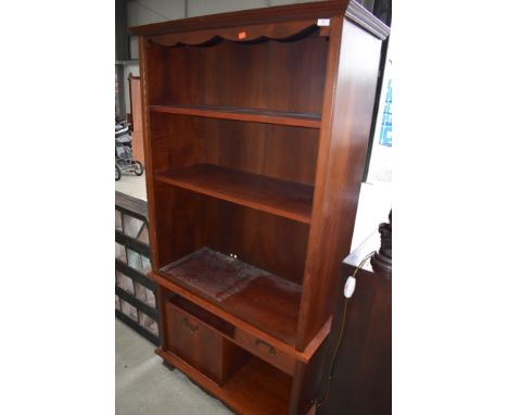 A modern mahogany effect entertainment style book shelf, approx. Width 97cm