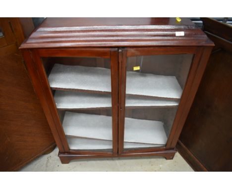 An early 20th Century stained frame low bookcase on bracket feet, approx. width 80cm, height 100cm, depth 25cm