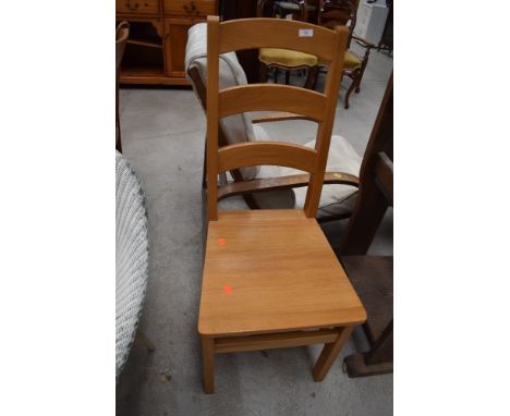A modern hard seat ladder back chair