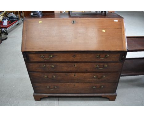 A 19th Century mahogany bureau , 4 long drawers, on bracket feet , drop flap sun bleached, approx. dimensions W106cm H106cm D