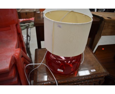 A vintage red glass table lamp