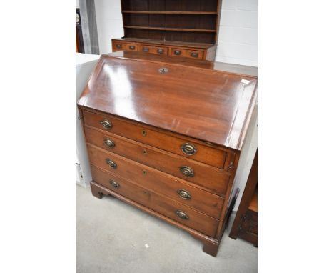 A 19th Century mahogany bureau, fitted interior, drop flap over four long drawers on bracket feet, approx dimensions width 99
