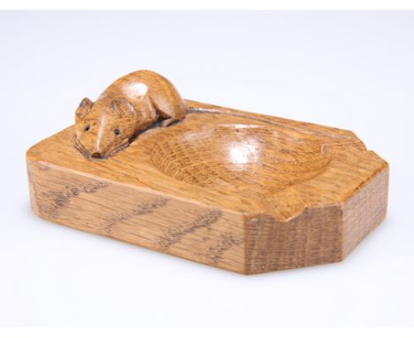ROBERT THOMPSON OF KILBURNA MOUSEMAN ADZED OAK ASHTRAY, CIRCA 1980, of characteristic form, with carved mouse signature. 10cm