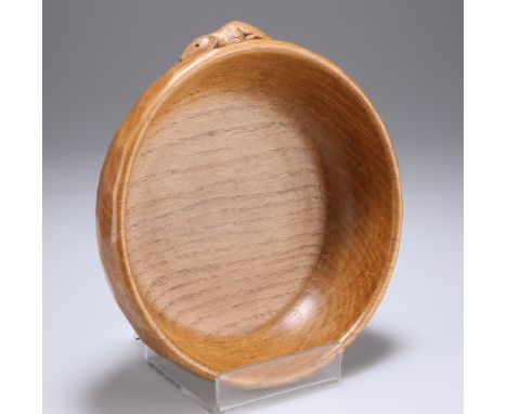 ROBERT THOMPSON OF KILBURN
A MOUSEMAN OAK NUT BOWL, CIRCA 1980, circular, with adzed exterior, with carved mouse signature. 1
