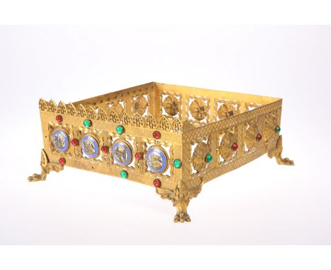 A GOTHIC REVIVAL 'JEWELLED' BRASS MISSAL STAND, CIRCA 1870, pierced square form, decorated to two sides with enamel roundels 