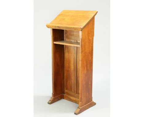 ROBERT THOMPSON OF KILBURN
A MOUSEMAN OAK LECTURN, CIRCA 1950, the sloping top above a concealed shelf, the whole of panelled