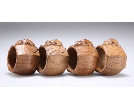 ROBERT THOMPSON OF KILBURNA SET OF FOUR MOUSEMAN OAK NAPKIN RINGS, octagonal, each with carved mouse signature. 4.7cm wideThe
