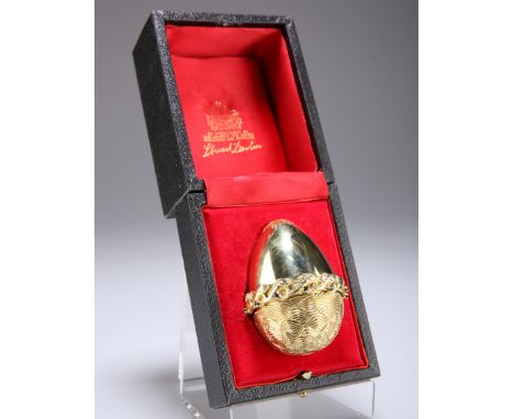 STUART DEVLIN (1931-2018)AN 18 CARAT GOLD GEM-SET EGG, London 1987, set with rubies, sapphires and diamonds, opening to revea