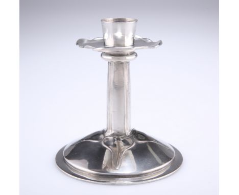 ARCHIBALD KNOX (1864-1933) A LIBERTY &amp; CO TUDRIC PEWTER CANDLESTICK, NO.023,&nbsp;of squat form with broad quatrefoil dri