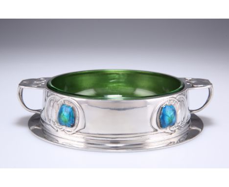 ARCHIBALD KNOX (1864-1933)
A LIBERTY &amp; CO TUDRIC PEWTER AND ENAMEL BUTTER DISH, NO. 0163, circular with bifurcated handle