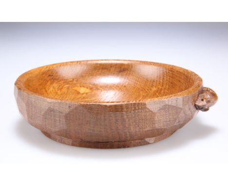 ROBERT THOMPSON OF KILBURN
A MOUSEMAN OAK NUT BOWL, circular, the adzed exterior with small carved mouse signature. 14.5cm di