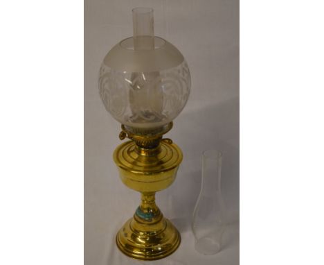 Brass oil lamp with spare chimney