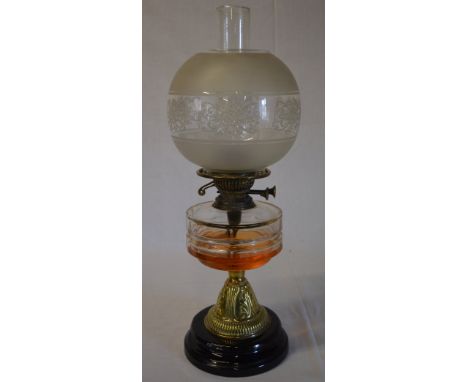 Brass paraffin lamp with ornate frosted glass style shade