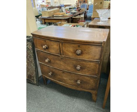 An early 19th century mahogany bow front chest of two short and two long drawers, on bracket feet, 87cm 