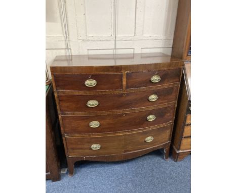 A 19th century mahogany bow front chest of two short over three long drawers with crossbanded top and satinwood inlaid frieze