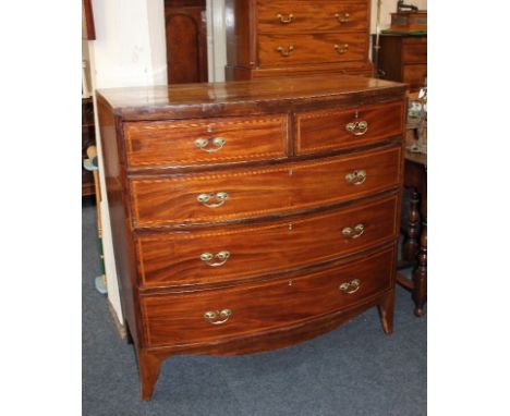 A George III inlaid mahogany bowfront chest of two short over three long drawers, with satinwood banding on bracket feet (a/f