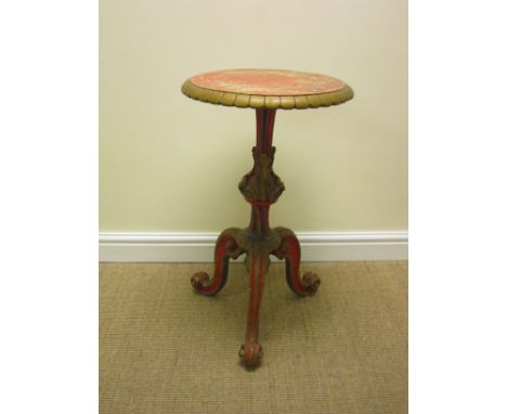 A 19th Century giltwood and red painted Lamp Table with circular top on leafage carved column and tripod base, 18in diam