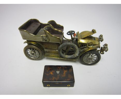 A musical Cigarette Box and Vesta Case in the form of a vintage car, 9in and a miniature tortoiseshell Music Box, 2 3/4 in A/