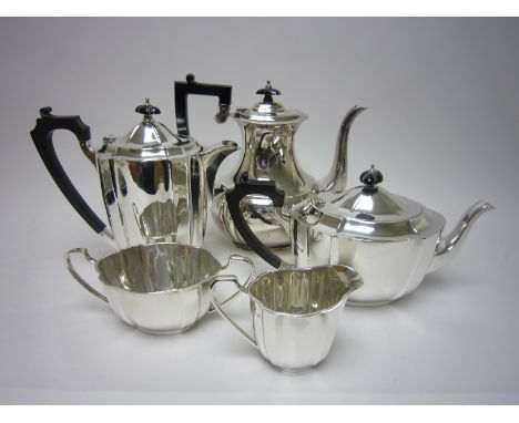 An Edward VIII/George VI four piece silver shaped oval Tea Service, Birmingham 1936/7 and a plated Coffee Pot of similar desi