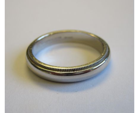 A TIFFANY & CO platinum Wedding Band engraved initials to inside, ring size R