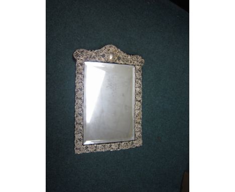 A Victorian silver mounted large Dressing Table Mirror with floral and scroll embossing, Birmingham 1896, 19 x 12in