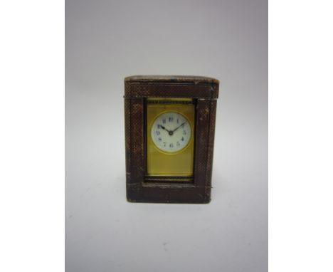 A late 19th Century brass cased Carriage Clock with lever escapement, circular dial with engraved surround, 6in, with origina