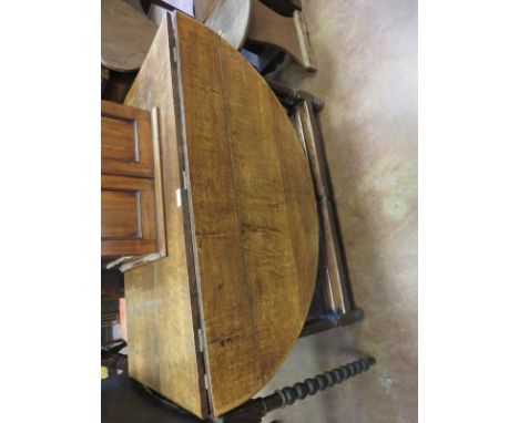 An antique oak double gate-leg Table with rounded ends on turned and square supports and square stretchers, 3ft 10ins x 5ft 6