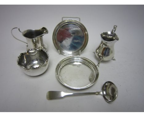 A small silver baluster Cream Jug on three shaped feet, Birmingham 1962, another Jug, A/F, a pair of silver Pin Trays, Birmin