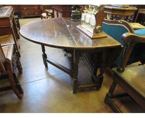 A late 17th century oak oval Gate-leg Table fitted drawer on turned and square supports and stretchers, 4ft 1in x 4ft 8in