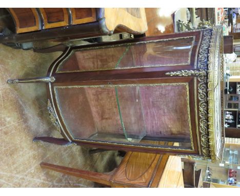 A 19th Century French Cabinet in kingwood with bowfront, fitted glass shelf enclosed by glazed door, gallery over with swag d