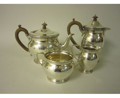 A George V silver four piece circular Tea Service with Celtic frieze, London 1924/5, maker: J.R.