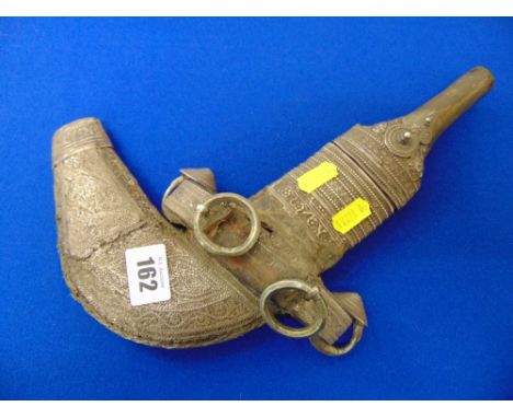 An antique Silver mounted eastern dagger and sheath