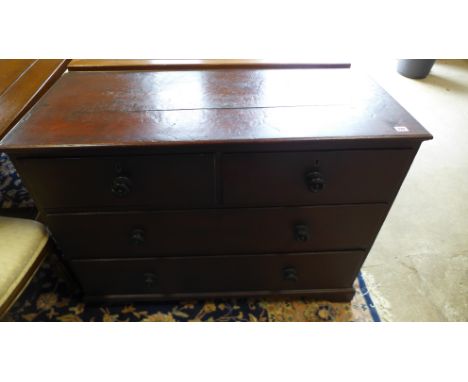 A small George III oak chest of two short over two long drawers with walnut crossbanding, raised on bracket supports - Height