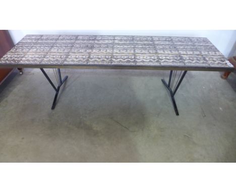 An unusual 1960/70's tile top coffee table with hand decorated tiles - Height 46cm x 153cm x 47cm 