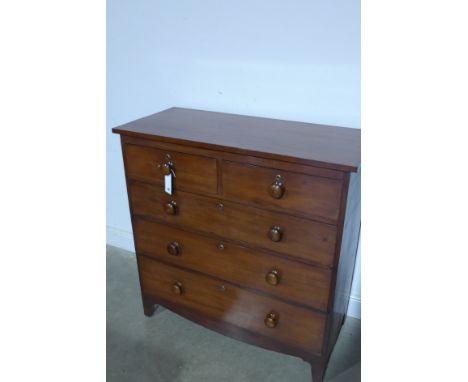An early 19th century mahogany chest of two small and three long drawers with turned handles on bracket feet - 118cm x 116cm 