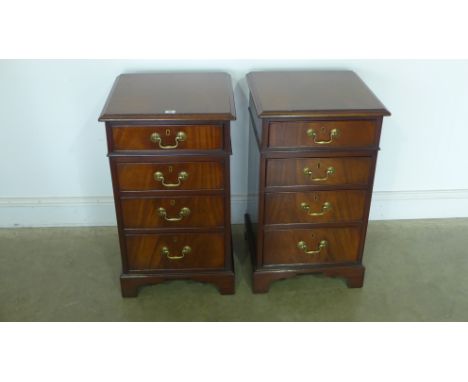 A pair of mahogany four drawer bedside chests with brass drop handles on bracket feet - 76cm x 45cm x 45cm 