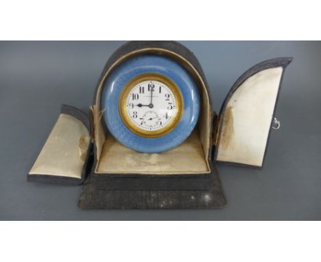 A blue enamel surround travel clock retailed by Harrods Ltd in case - case damaged, clock not working