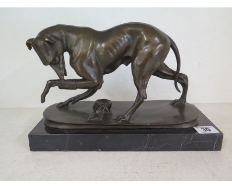 A modern bronze figure of a hound on a marble base